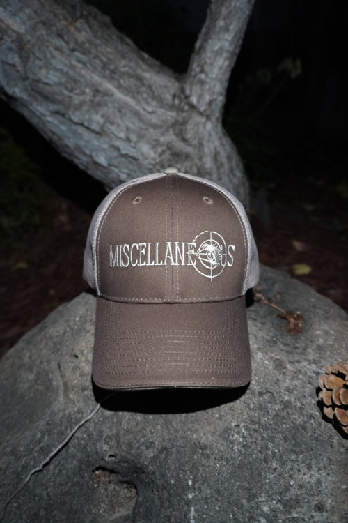 Brown trucker hat with khaki mesh back and white embroidered Miscellaneous logo