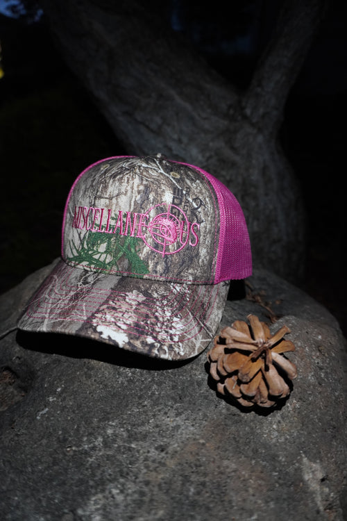 Realtree Edge camo trucker hat with neon pink mesh and pink embroidered Miscellaneous logo