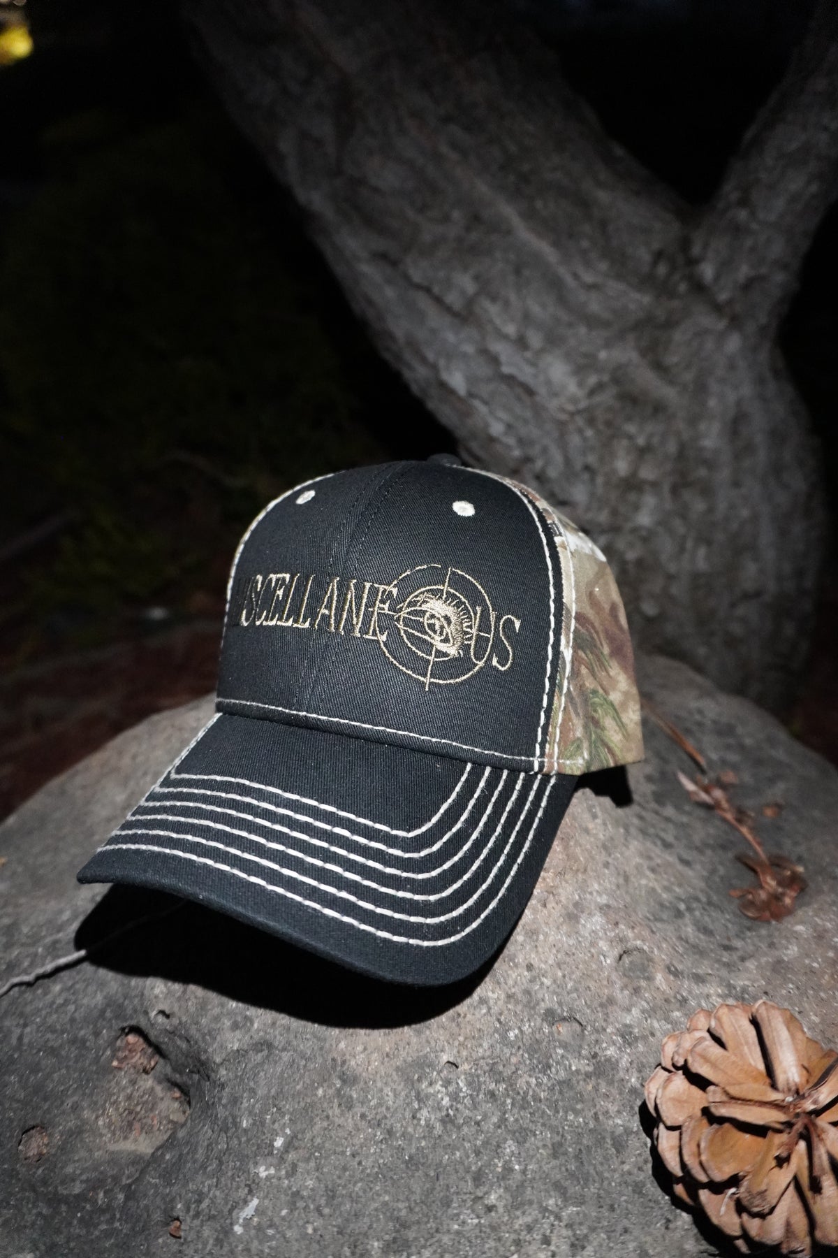 Black and Realtree AP camo hat with stone-stitched brim and embroidered Miscellaneous logo