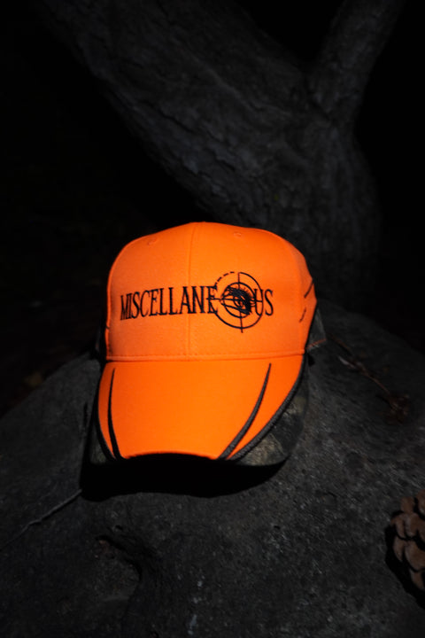 Blaze orange hat with Realtree camo trim and black embroidered Miscellaneous logo