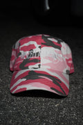 Pink camo dad hat with white embroidered Miscellaneous logo