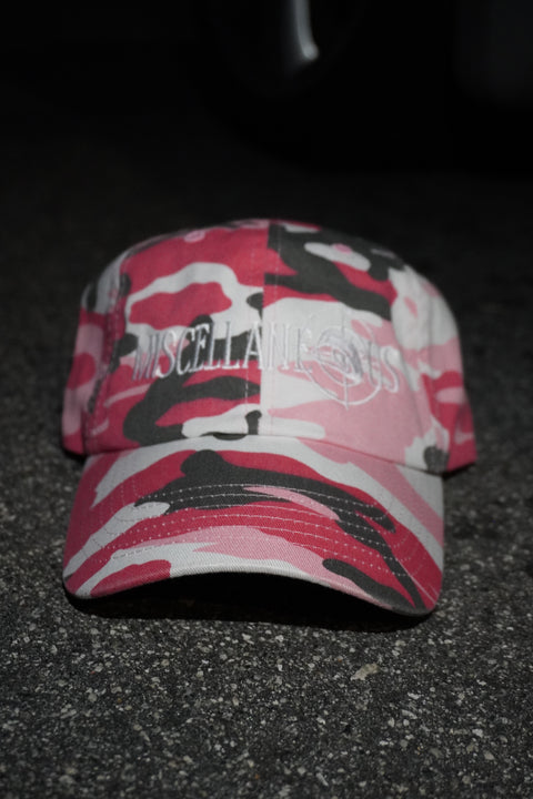 Pink camo dad hat with white embroidered Miscellaneous logo